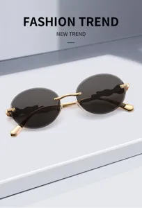 Vintage Sonnenbrille mit goldenem Metallrahmen und ovalen Gläsern für Damen und Herren.