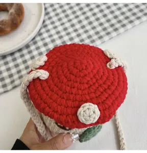 Detailed top view of a cute handmade crochet mushroom shaped mini crossbody bag