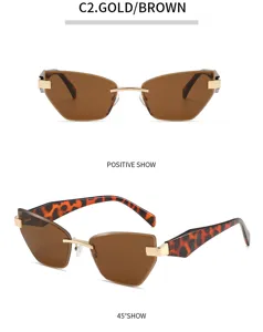 Schicke rahmenlose Katzenaugen-Sonnenbrille mit braunen Gläsern, Goldakzenten und Leopardenbügeln.