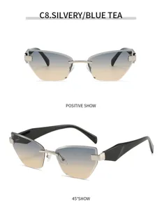 Schicke rahmenlose Katzenaugen-Sonnenbrille mit Farbverlauf und breiten schwarzen Bügeln.