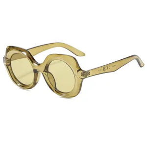 Vintage chunky round sunglasses for women, stylish transparent frame with yellow lenses.