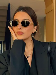 Chic gafas de sol ovaladas retro para mujer, montura de metal, estilo elegante.