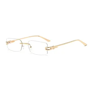 Gafas de sol sin montura elegantes para mujer con montura de metal dorado y diseño moderno.