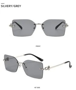 Lunettes de soleil sans monture carrées tendance pour femmes avec tempes en chaîne et verres gris.
