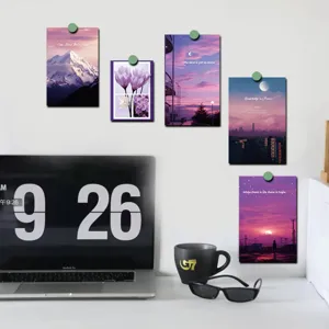 A detailed view of aesthetic purple wall decorative cards and postcards hanging on a wall.