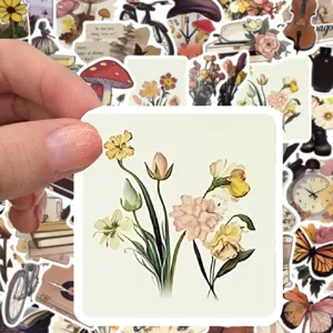 Detailed view of a vintage floral sticker, waterproof decorative art for journals and laptops.