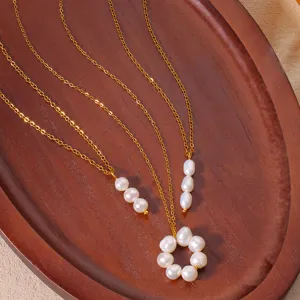 Detailed view of elegant freshwater pearl pendant necklace with delicate gold chain jewelry.
