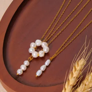 Exquisite multi-strand gold chain necklace featuring lovely natural freshwater pearl pendant details.