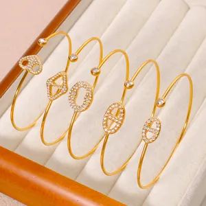 Vergoldete Titanstahl Zirkon Armreifen, modische offene Armbänder für Damen Schmuck Set.