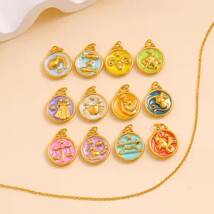 Close-up of 18k gold plated stainless steel zodiac charms with colorful enamel details.