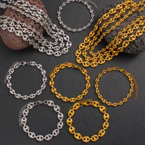 Closeup view of stainless steel coffee bean chains and bracelets in gold and silver.