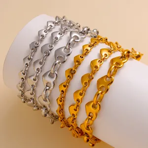 Stainless steel heart link bracelet set, gold and silver fashion jewelry for women, elegant style.