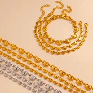 Gold and silver heart link chain detail shot, showcasing stainless steel heart charms for styling.