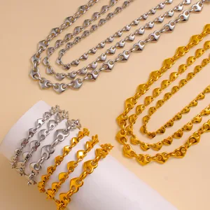 Stainless steel heart link necklace and bracelet set in gold and silver, detailed view.