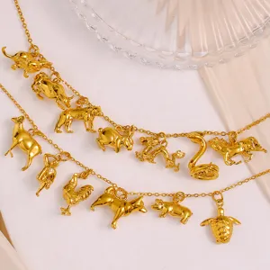 Close-up detail of 18K gold-plated Chinese zodiac animal pendants DIY charms set.