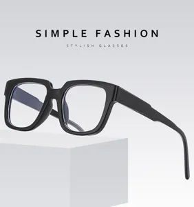 Detailed shot of black frame square glasses with clear anti blue light lenses on display.