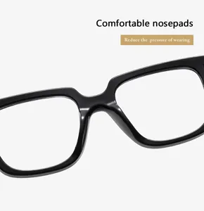 Detailed close-up view of comfortable black eyeglass nosepads and frame bridge design.