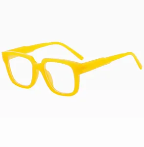 Close-up of trendy yellow thick-rimmed square optical glasses, clear blue light blocking eyewear.