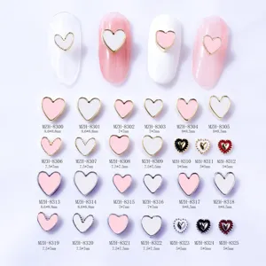 Various heart shaped metal bordered nail art charms with model numbers and sizes