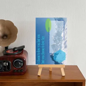 Decorative art card detail shot featuring blue mountain scenery and inspiring English quotes.