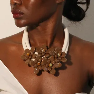 Detailed close-up of a double-layer acrylic flower statement necklace on a model