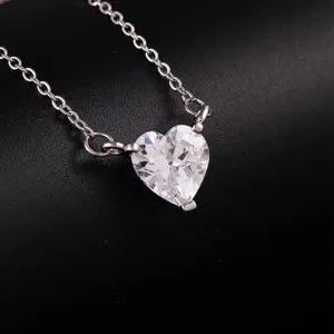 Silver-tone necklace featuring a sparkling faceted heart-shaped clear cubic zirconia pendant.