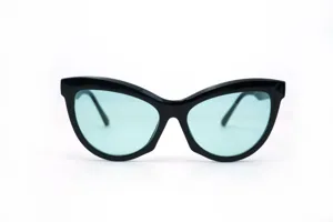 Classic black cat-eye sunglasses with light blue lenses, stylish retro design detail.