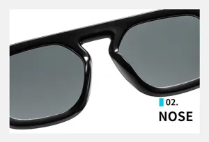 Nahaufnahme des feinen Nasenstegs von schwarzen Oversized-Sonnenbrillen im Retro-Look.