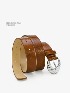 Brown crocodile embossed women leather belt with silver buckle, fashion waist accessory detail.