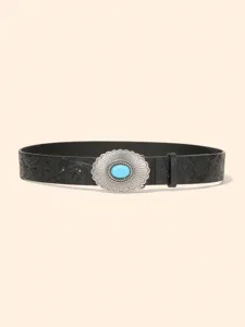 Detailed view of western style embossed black leather belt with turquoise stone buckle.