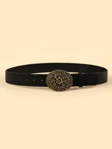 Close-up detail of the vintage bronze floral carved oval buckle on a black casual leather belt.