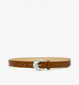 Detail view of a fashionable embossed women belt with a sleek silver pin buckle design.
