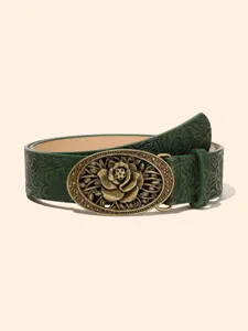 Close-up detail shot of vintage green embossed leather belt with ornate oval bronze rose buckle