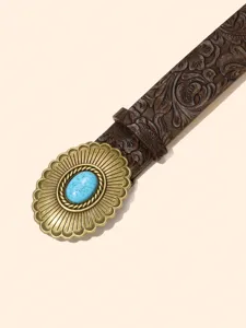 Vintage Western leather belt with intricate floral embossing and a large turquoise stone buckle detail.