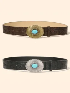 Detailed view of retro embossed leather belts with western style turquoise stone buckles.