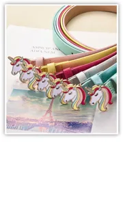Detailed view of colorful kids belts with cute unicorn buckles, adjustable thin waist accessory.