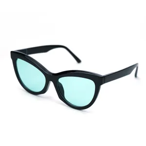 Fashion cat eye sunglasses for women with trendy black frame and mint green lenses.