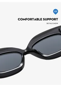 Vista dettaglio occhiali da sole cat-eye neri, montatura oversize di tendenza chic.