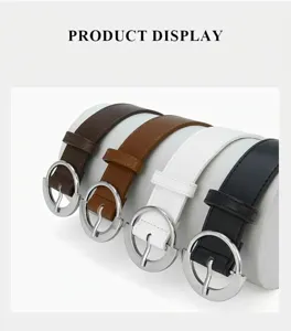 Detailed view of women's multi-color fashion belts with round metal buckles on a display stand.