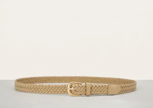 Detailed view of women's beige braided PU leather belt with metal buckle, close-up shot.