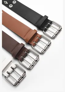 Wide leather belt with double prong buckle and punk style metal eyelets for daily wear details.