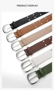 Detailed view of women's wide punk style studded belt featuring double-row metal rivets.