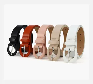 Detail shot of multi-color women's thin leather belts featuring round buckles and neat stitching.