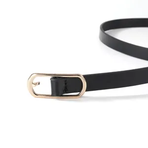 Close-up of a slim black PU leather belt featuring an elegant gold oval metal buckle design.
