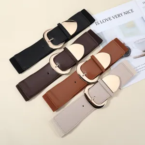 Detail shot of wide elastic waist belt for women with stylish metallic buckle and stretch fabric.