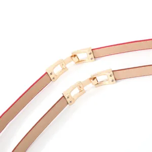 Close-up detail of women thin leather waist belts with elegant gold-tone metal clasp buckles.