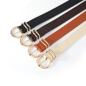 Detail view of stylish women leather belts with gold round buckles in multiple colors.