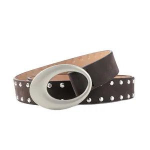 Women's retro suede belt with large oval buckle and metal rivets, stylish jeans accessory.