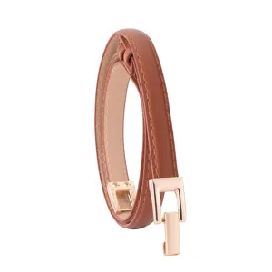 Close-up detail of the slim brown women's belt showing the sleek gold-tone metal hook buckle.