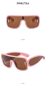 Futuristic pink shield sunglasses with brown lenses, stylish cyberpunk eyewear detail view.